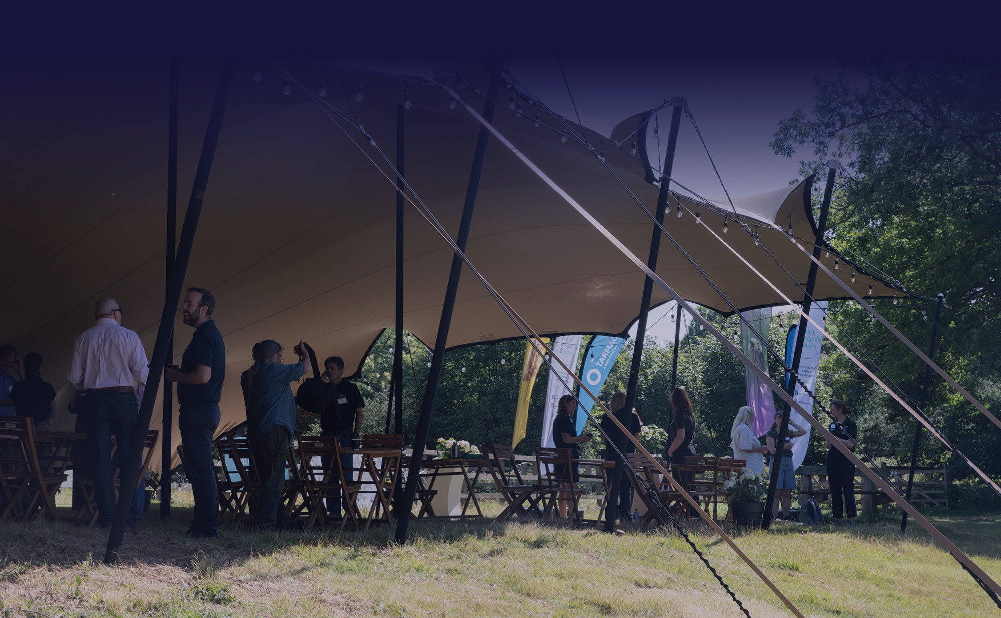 Gathering under a tent