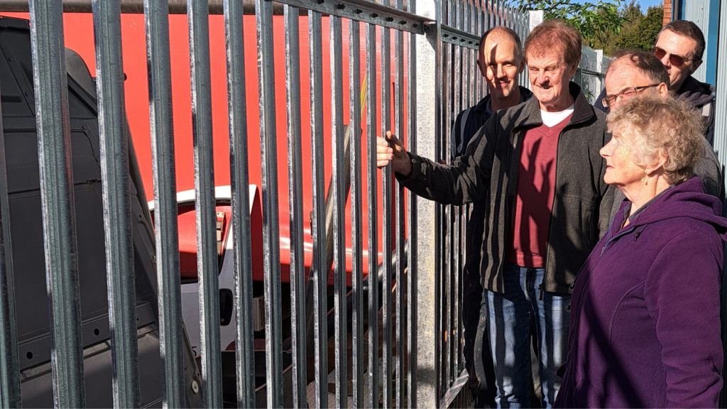 Tarmac in the community: vintage car society secures funding for fence  